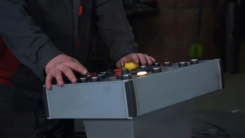 Worker in factory stand behind control panel, machine, dashboard, device control Stock Footage 120062757