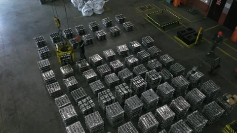 Worker factory using a winch lowers a load metal Video stock 266140317