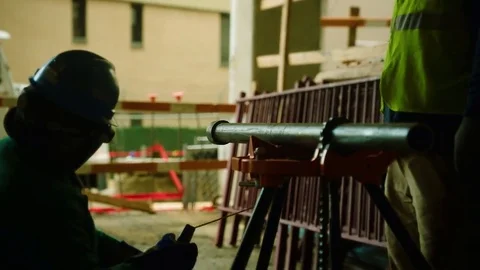 A worker in a factory welds. Stock Footage
