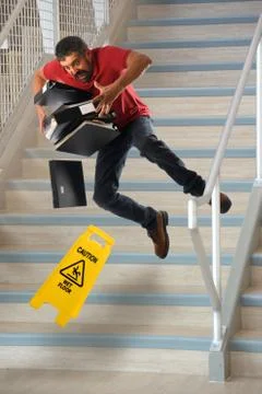 Worker Falling on Stairs Stock Photos