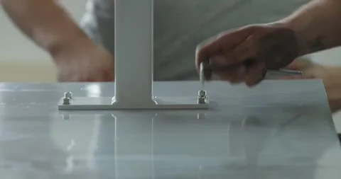 Worker Fastening Glass Railing Post to Base Plate, Metal Workshop, Close Up Shot Stock Footage 340303729