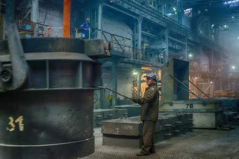 Worker on ferroalloy factory Stock Photos