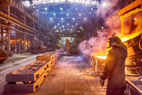 Worker on ferroalloy factory Stock Photos