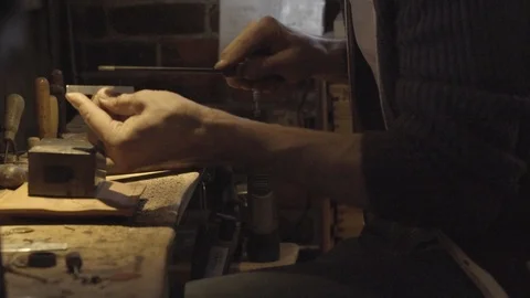 Worker filing the metal piece to make it smooth Stock Footage 87613153