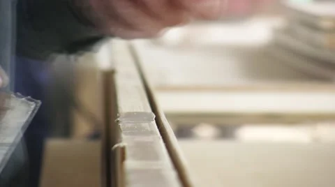 Worker fill small nicks, gouges, and cracks on the furniture with wood putty. Video stock 57216666