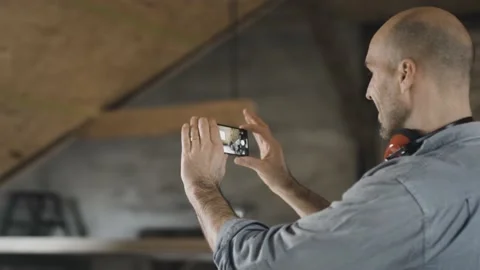 Worker filming his construction site Stock Footage 149291790