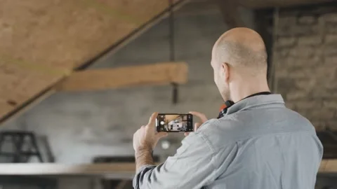 Worker filming his construction site Stock Footage 149292155