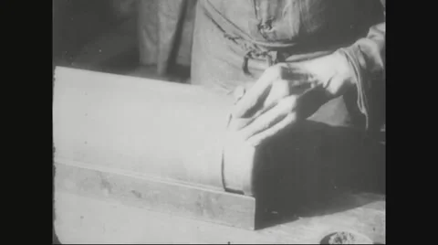 Worker fitting base of metal casing on missile Stock Footage 43312163