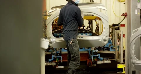 Worker Fitting White Car Body Panel at Jig, Automotive Assembly, Medium Shot Vídeo Stock 340302152