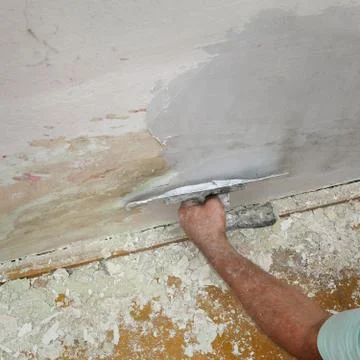 Worker fix damaged wall Stock Photos