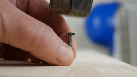 Worker Fix a Plank Using Nails and a Hammer Stock Footage 122167886