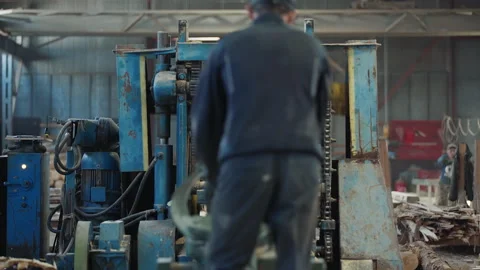 Worker Fixates Log Wood Material In Processing Machine At Carpentry Workshop Stock Footage 224216606