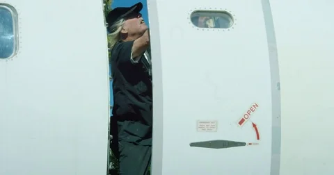 Worker Fixes Aircraft Door and Closes It Stock Footage 73010762