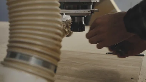The worker fixes the necessary drill in the robotic machine Stock Footage 105044496