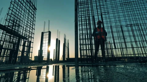 A worker fixes reinforcement bars on building. Stock Footage 131164578