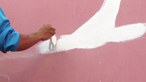 Worker fixing cracks on wall, spreading plaster using trowel, Repair cracked wal Stock Footage 232217003