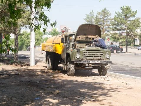 Worker Fixing Vehicle Engine Stock Photos