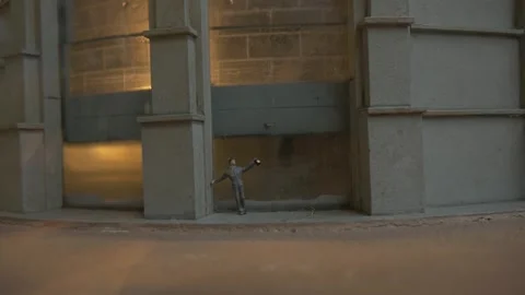 Worker flashlight drunk miniature figurine small building wall detail water Stock Footage 344111339