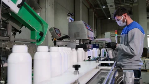 A worker is focused on operating a production line Stock Footage 325328794