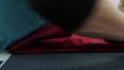 Worker folding red towels in the textile industry. Stock Footage 72585838