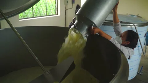 Worker in the food factory opens the pasteurization tank. Dairy products - Vidéo 202297662