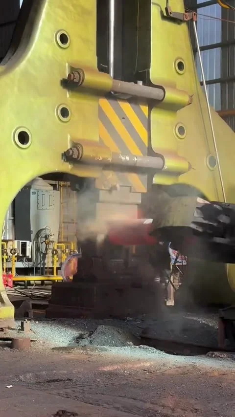 Worker Forging Red Hot Metal with Large Industrial Press in Steel Factory China Stock Footage 339203351
