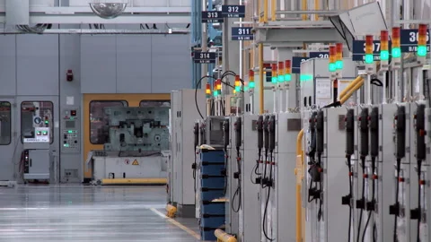 A worker on a forklift is driving through the factory Stock Footage 92197550
