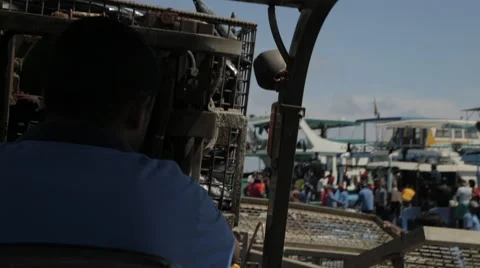 Worker On Forklift Turns The Container With Tuna Video stock 60918516