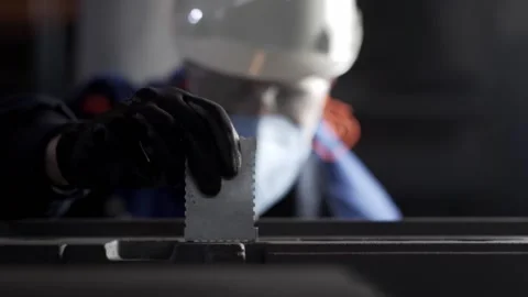 A worker in the foundry measures the paint thickness in the molds. Stock Footage 146636135