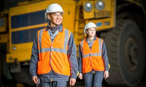 Worker in front of a bug truck Stock Photos