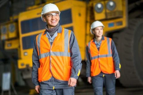 Worker in front of a bug truck Stock Photos