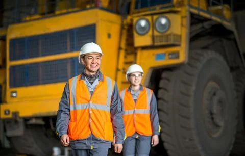 Worker in front of a bug truck Stock Photos