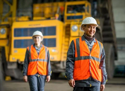 Worker in front of a bug truck Stock Photos