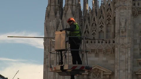 Worker in front of the Duomo of Milan Stock Footage