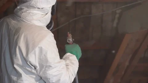 Worker In Full Protective Clothing Spraying Pest Control Treatment On Stock Footage 199620426