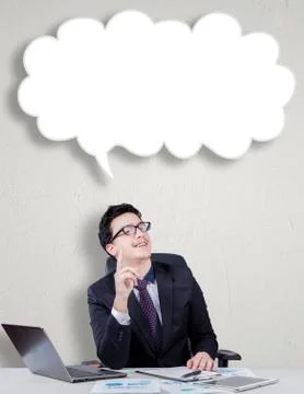 Worker gets idea under cloud bubble Stock Photos