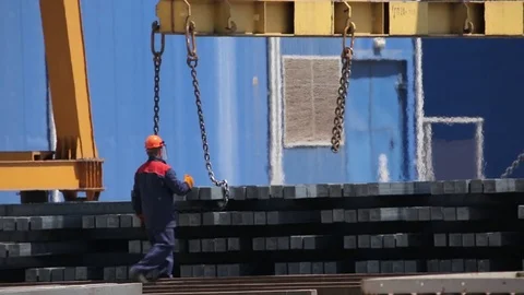 Worker gets paint on the metal bars Stock Footage 72713851