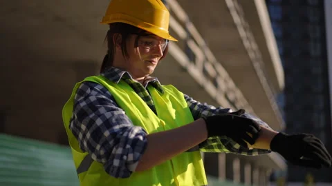 Worker Getting Ready for a Task on the Job Site, Looking Focused and Prepared Stock Footage 311860953