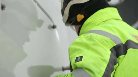 Worker In Glasses and Green Jacket Using Screw Gun Stock Footage 72371386