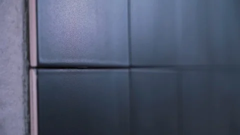 The worker glosses over the seams on the tile Stock Footage 121186544