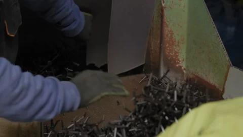 Worker Gloved Hands Pushing Plastic Scrap Into Grinder At Recycling Plant Stock Footage 337913276