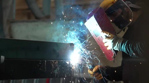 Worker with gloves and welding mask welding in the factory. Stock Footage 247698676