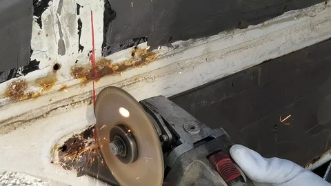 Worker in gloves cutting a metal pipe angle grinder, close up Stock Footage 114757850