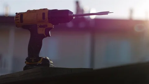 Worker in gloves drills a board with a screwdriver with a nozzle a feathe Vídeo Stock 111470973