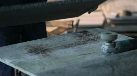 Worker in gloves grinds black marble tiles at construction Stock Footage 37657823