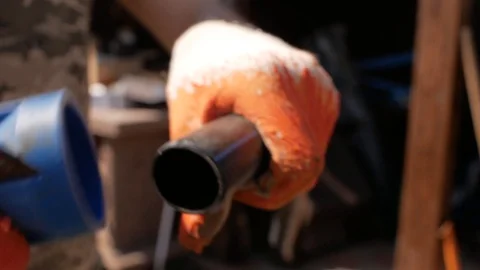 Worker in gloves makes a chamfer on a plastic pipe. automatic watering system Stock Footage 107935469