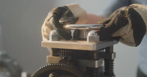 Worker in gloves is twisting some valve Stock Footage 130967950