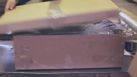 Worker glue tape on the box 스톡 동영상 75979863