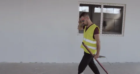 Worker goes and wears protective glasses before work. Stock Footage 126910797