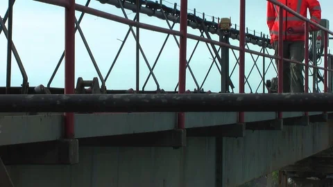 Worker goes on the metal construction. Video stock 95703761